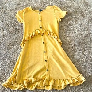 Yellow art class dress mid length buttons made in China 10/12 cloth fabric sheer